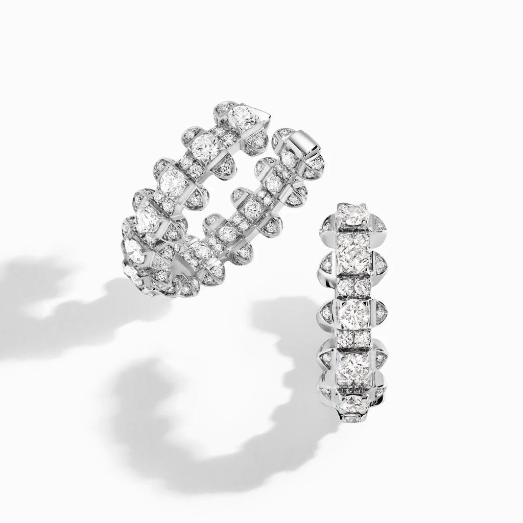 Pair of diamond hoop earrings on a white background