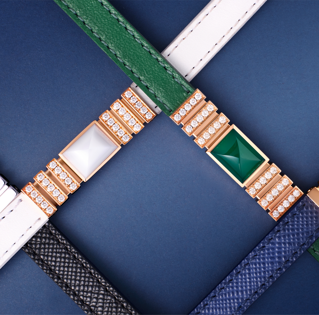 leather bracelets in black, white, green and navy cross over each other forming a diamond pattern